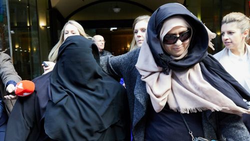 Moutia Elzahed (left) is seen leaving the Downing Centre Local Courts in Sydney today. (AAP)