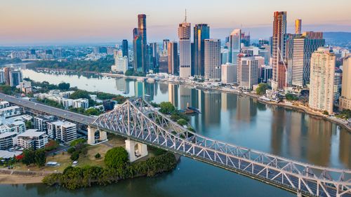 An aerial view of Brisbane's CBD and the Brisbane River, including the Story Bridge