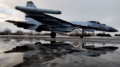 In this photo taken from video and released by the Russian Defense Ministry Press Service on Thursday, Jan. 27, 2022, a Russian Su-35S fighter jets taxies after landing on an airfield in Belarus to attend a Russia-Belarus military drills. 