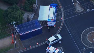 A woman in her 50s has been injured after being shot by police in Melbourne after she allegedly ran at them with a knife.