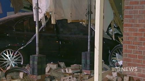 The car became airborne before it ploughed into the house. (9NEWS)