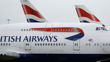 British Airways planes are parked at Heathrow Airport in London