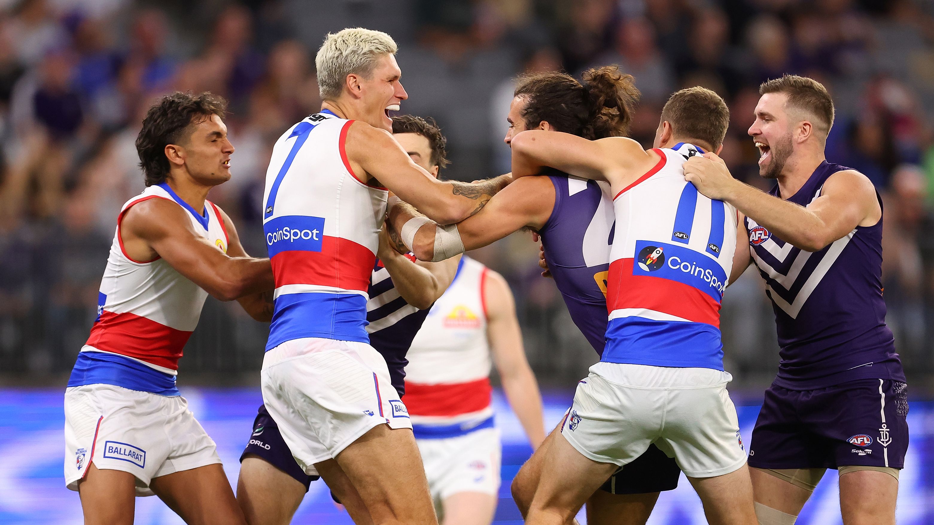 Alex Pearce of the Dockers and Rory Lobb of the Bulldogs wrestle before the first bounce during the round six AFL match between Fremantle Dockers and Western Bulldogs at Optus Stadium, on April 21, 2023, in Perth, Australia. (Photo by Paul Kane/Getty Images)