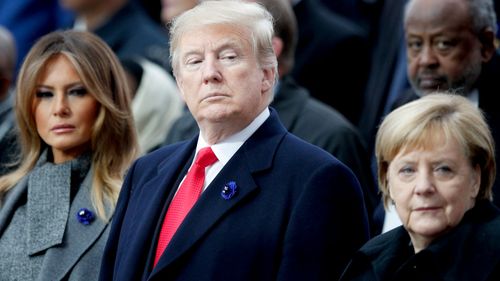 US President Donald Trump with First Lady Melania Trump and German Chancellor Angela Merkel.