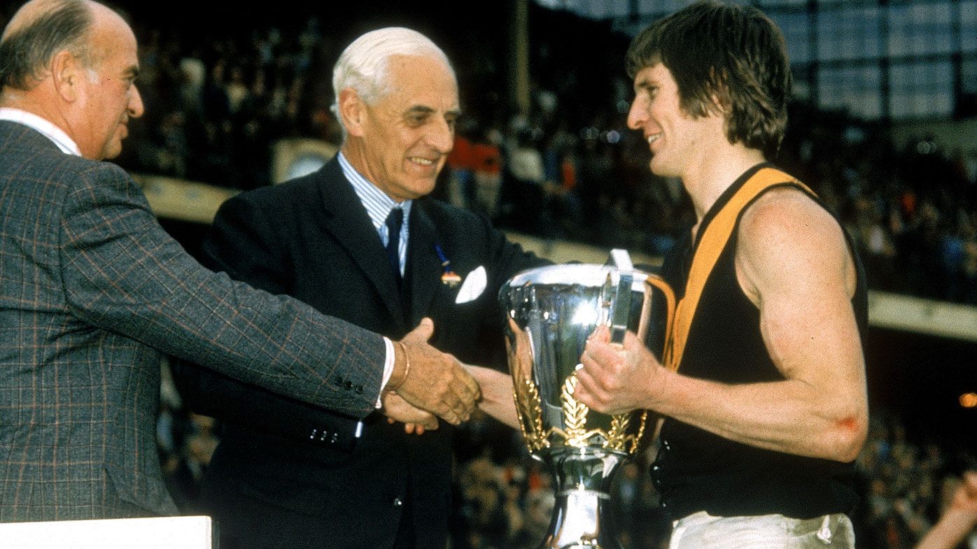 Royce Hart of the Tigers holds the 1974 trophy after the VFL Grand Final. (Getty)