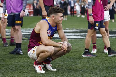 Josh Dunkley slumps to the ground after the Lions' loss.