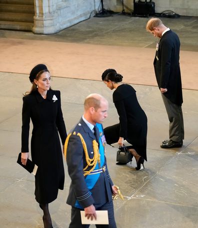 LONDON, ENGLAND - SEPTEMBER 14: Catherine, Princess of Wales, Prince William, Prince of Wales, Meghan, Duchess of Sussex and Prince Harry, Duke of Sussex pay their respects in The Palace of Westminster after the procession for the Lying-in State of Queen Elizabeth II on September 14, 2022 in London, England. Queen Elizabeth II's coffin is taken in procession on a Gun Carriage of The King's Troop Royal Horse Artillery from Buckingham Palace to Westminster Hall where she will lay in state until th