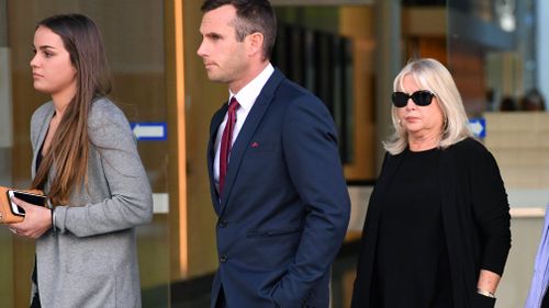 Witnesses Simon Gerbic (centre) and Cheryl Aiken (right) are seen leaving the Supreme Court in Brisbane. Picture: AAP