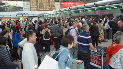 Stranded passengers wait at Rome Airport. (AAP)