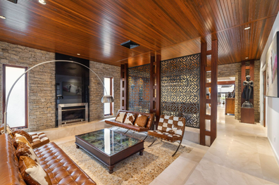 Property for sale in Benowa Waters, Queensland, with fossil-infused limestone flooring.