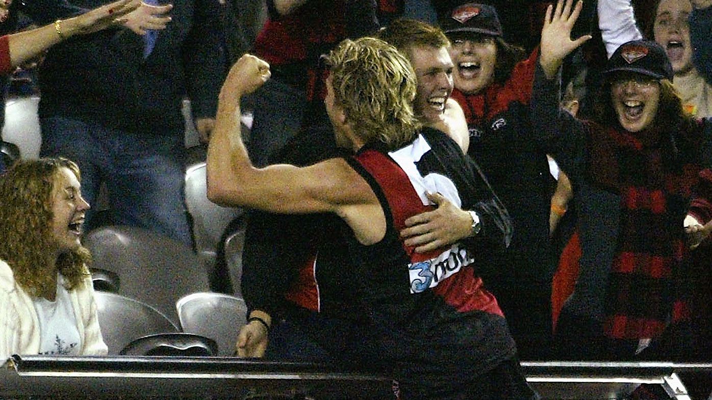 James Hird reveals how deregistration fears fuelled iconic 2004 hug with Essendon fan