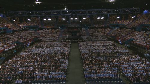 Thousands attend memorial for Constables Rachel McCrow and Matthew Arnold in Queensland.