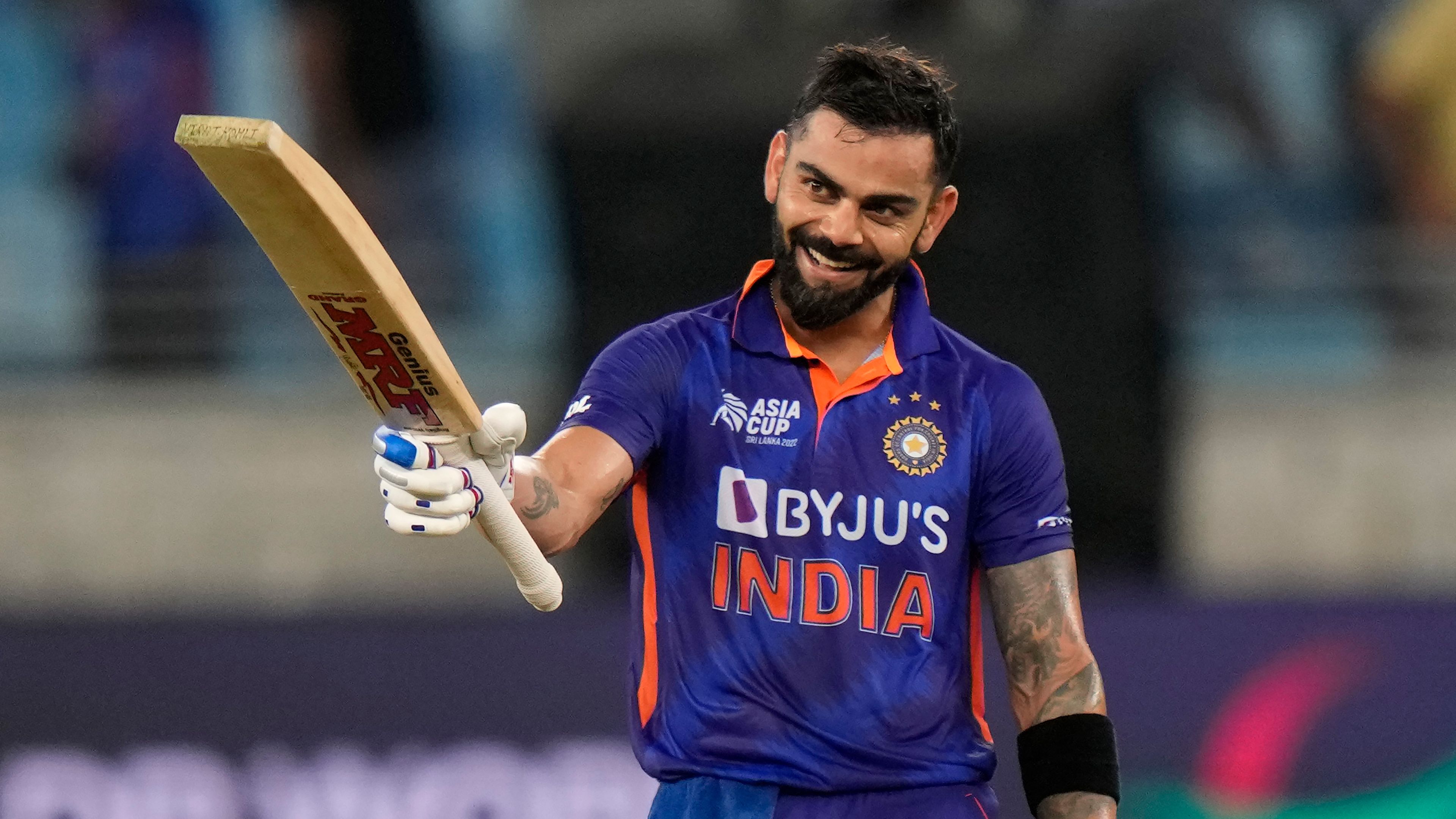 India&#x27;s Virat Kohli raises his bat to celebrate scoring a century during the T20 cricket match of Asia Cup between India and Afghanistan, in Dubai, United Arab Emirates, Thursday, Sept. 8, 2022. (AP Photo/Anjum Naveed)