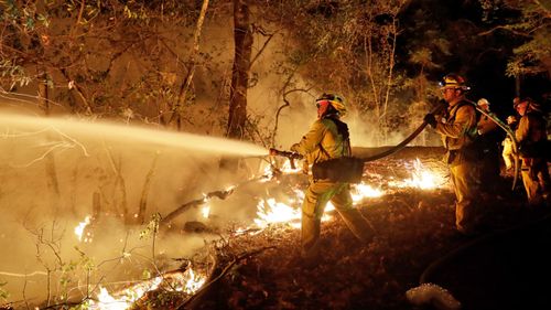 Firefighters started to gain more control of blazes raging in the wine country as others erupted near Los Angeles and Santa Cruz. (AP)