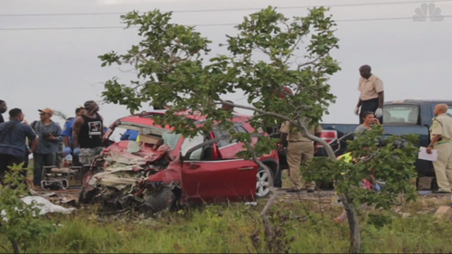 Red Chevy SUV crumpled after accident.