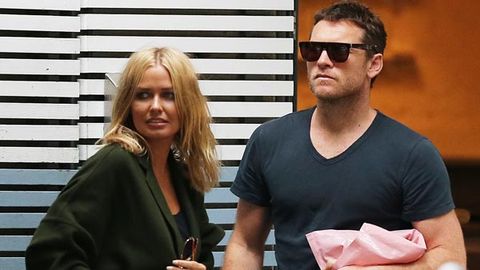 Lara Bingle and Sam Worthington's tell-tale hint at 'secret marriage': Look what they're wearing on their ring fingers!