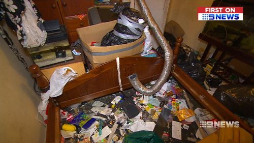Piles of soiled clothing and food scraps are also littering the home. (9NEWS)