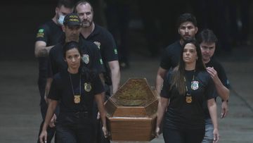 Federal police officers arrive with recovered human remains believed to be of the Indigenous expert Bruno Pereira of Brazil and freelance reporter Dom Phillips of Britain, at the Federal Police hangar in Brasília, Brazil, Thursday,, June 16, 2022. 