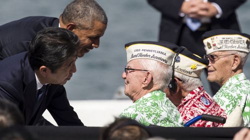 The two leaders greet veterans at Pearl Harbour. (AFP)