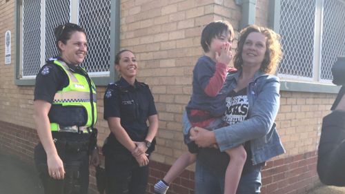 The boy and his mother were reunited at a police station. (Twitter / @NearyTy_9)