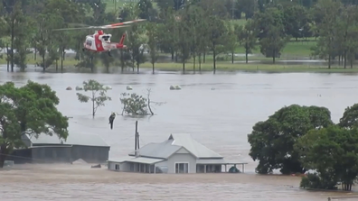 Five people, including two children, had to be winched from the roof of their house. 