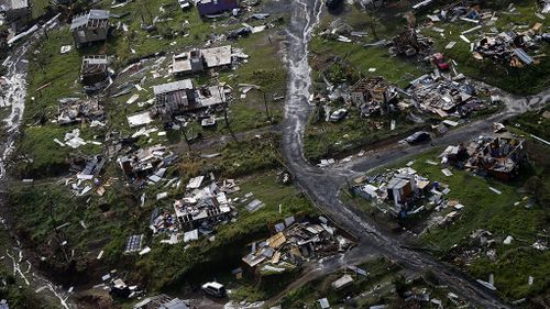 Debris scatters a destroyed community in the aftermath of Hurricane Maria in Toa Alta, Puerto Rico. (AAP)