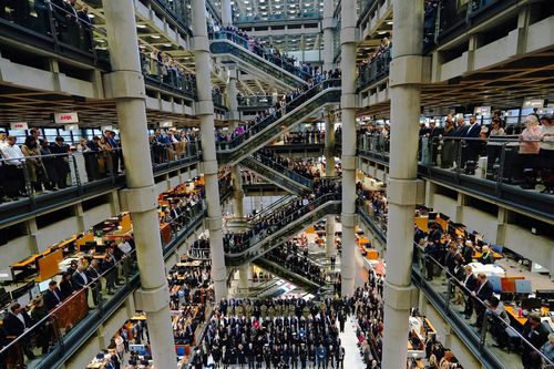 City workers attend a Remembrance Day ceremony at Lloyd's of London, in the City of London, to mark Armistice Day, the anniversary of the end of the First World War, Friday, November 11, 2022.