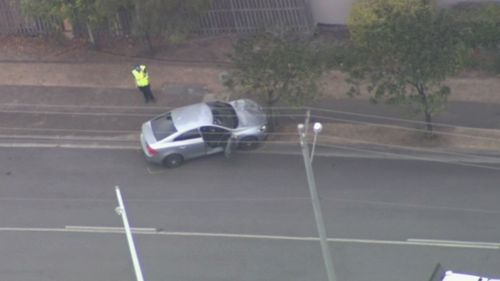 The car was abandoned a short distance from the accident site on Brisbane Street and the two men fled on foot.