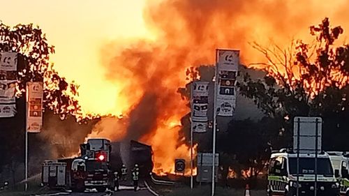 Two people have been killed after two road trains crashed and burst into flames on the Kamilaroi Highway in NSW. 