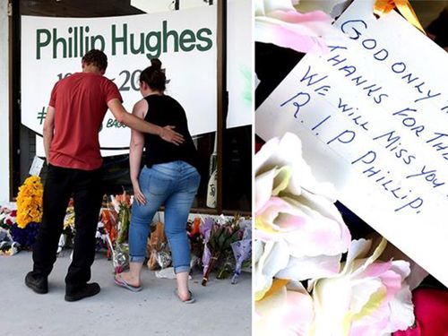 Mourners lay flowers at one of several makeshift shrines to Phillip Hughes, who will be farewelled at a funeral today. (9NEWS)