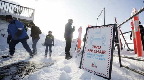 COVID-19 measures indicating two per chair on the chairlifts at Thredbo.