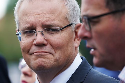 Prime Minister Scott Morrison has ramped up his attack on Labor's plan to lift wages, accusing Bill Shorten of forcing businesses to sack people to give others pay rises. (AAP Image/Stefan Postles) 