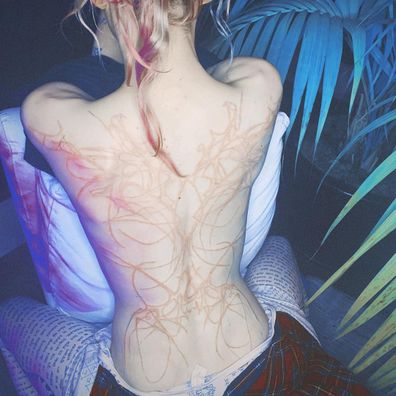 Grimes debuted an intricate back tattoo.