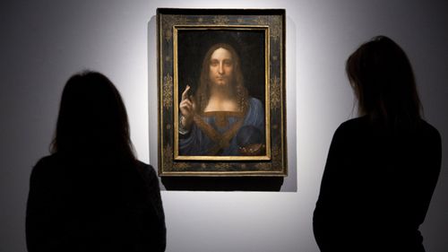 People look at Leonardo da Vinci's Salvator Mundi at Christie's in London, before the work was sold in New York.