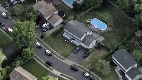 An aerial photo of the house and pool where the bodies were found. 