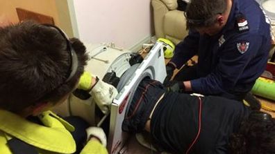 A 22-year-old western Sydney man was saved by NSW Fire and Rescue officers after spending three hours stuck inside a washing machine.
<br><br>
Bankstown Fire and Rescue posted photos of the bizarre rescue on their Facebook page on Monday.
<br><br>
"Recently the crew from D Platoon were turned out to a rescue incident in which a person had become trapped in a front loader washing machine," the post on the Bankstown Fire and Rescue page said.
<br><br>
"Upon arrival the crew was informed that the patients’ legs had been entrapped in the washing machine for at least 3 hours."