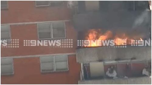 A man has been rescued from an apartment building on Nicholson Street in Carlton. (9NEWS)