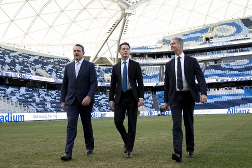 NSW Premier Chris Minns, with Ministers, Steve Kamper, left, and John Graham, right, at Allianz Stadium, where they have increased the number of concerts allowed from 4 to 20 per year in Sydney. May 3, 2023 Photo: Janie Barrett