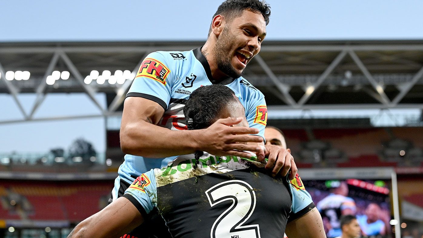 Sione Katoa of the Sharks is congratulated by team mates after scoring a try during the round 24 NRL match between the Cronulla Sharks and the Brisbane Broncos at Suncorp Stadium, on August 28, 2021, in Brisbane, Australia. (Photo by Bradley Kanaris/Getty Images)