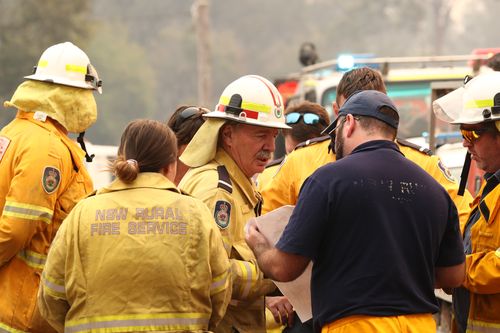 Firefighters battle bushfires in Busbys Flat, northern NSW, Wednesday, October 9, 2019. (AAP Image/Jason O'Brien) NO ARCHIVING