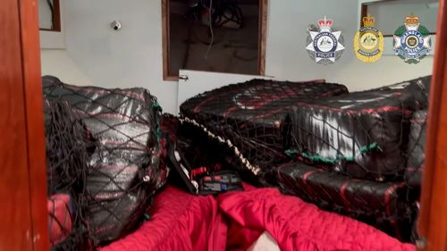 A group of 13 men, including two minors, have been charged as part of the largest-ever cocaine bust in Australia.