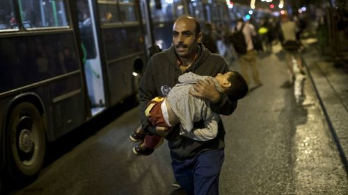 A Syrian man prepares to board a bus in Hungary bound for the Austrian border. (AAP)