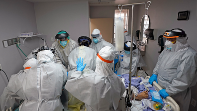 Dr. Joseph Varon, right, leads a team as they try to save the life of a patient unsuccessfully inside the Coronavirus Unit at United Memorial Medical Center, Monday, July 6, 2020, in Houston.