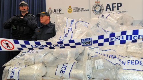 Australian Federal Police officers guard $566 million worth of crystal methamphetamine ('ice') and heroin after smashing a Hong Kong-based international drugs syndicate in Sydney in 2012. (Getty Images)