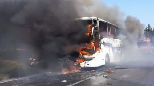 The Australian and New Zealand bus passengers were moved off the bus before flames engulfed the vehicle. (9NEWS)