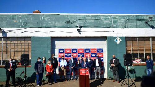 Rudy Giuliani speaks to the media in the back parking lot of Four Seasons Total Landscaping in Philadelphia.