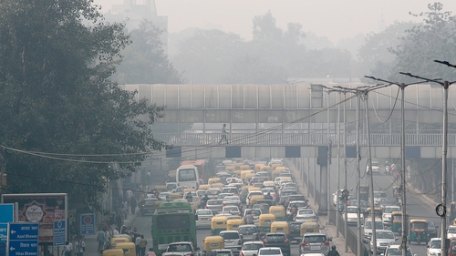 A pedestrian walks on a bridge above vehicle traffic in New Delhi, India, Tuesday, Nov. 12, 2019, as the city is enveloped under thick smog. The air quality index exceeded 400, about eight times the recommended maximum. A study released on Tuesday, May 17, 2022, blames pollution of all types for 9 million deaths a year globally, with the death toll attributed to dirty air from cars, trucks and industry rising 55% since 2000. (AP Photo/Manish Swarup, File)