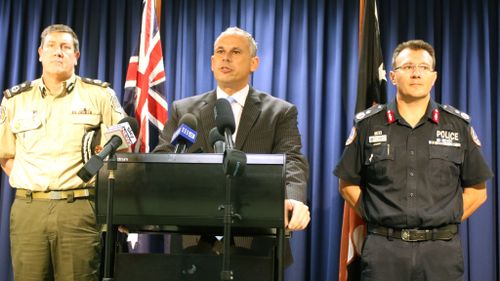 NT Chief Minister Adam Giles (centre), flanked by Corrections Commissioner Mark Payne (left) and Police Commissioner Reece Kershaw. (AAP)