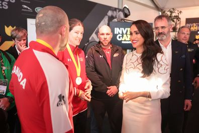 Meghan, Duchess of Sussex chats with members of the Canadian Invictus Team at the IGF Reception during day two of the Invictus Games The Hague 2020 at Zuiderpark on April 17, 2022