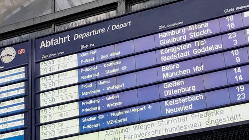 An information display shows cancelled and delayed trains at Frankfurt main station in Frankfurt, Germany. (AAP)